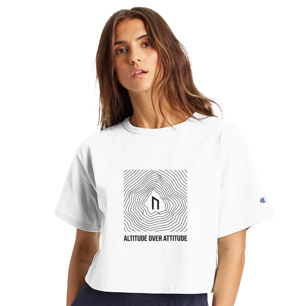 Female hybrid athlete wearing the Nordstoke Altitude crop tee with topographic summit print