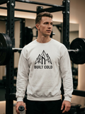Hybrid athlete wearing the Nordstoke Built Cold crewneck with Norse mountain print in a gym
