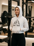 Female hybrid athlete wearing the Nordstoke Built Cold cropped hoodie in a gym